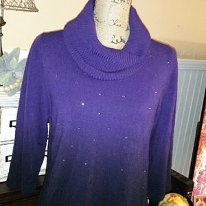 Festive purple cowl neck sweater.